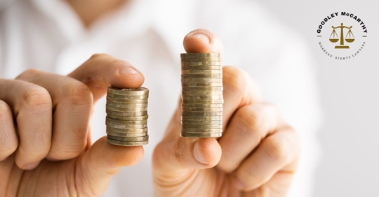employee holding coins in a stack